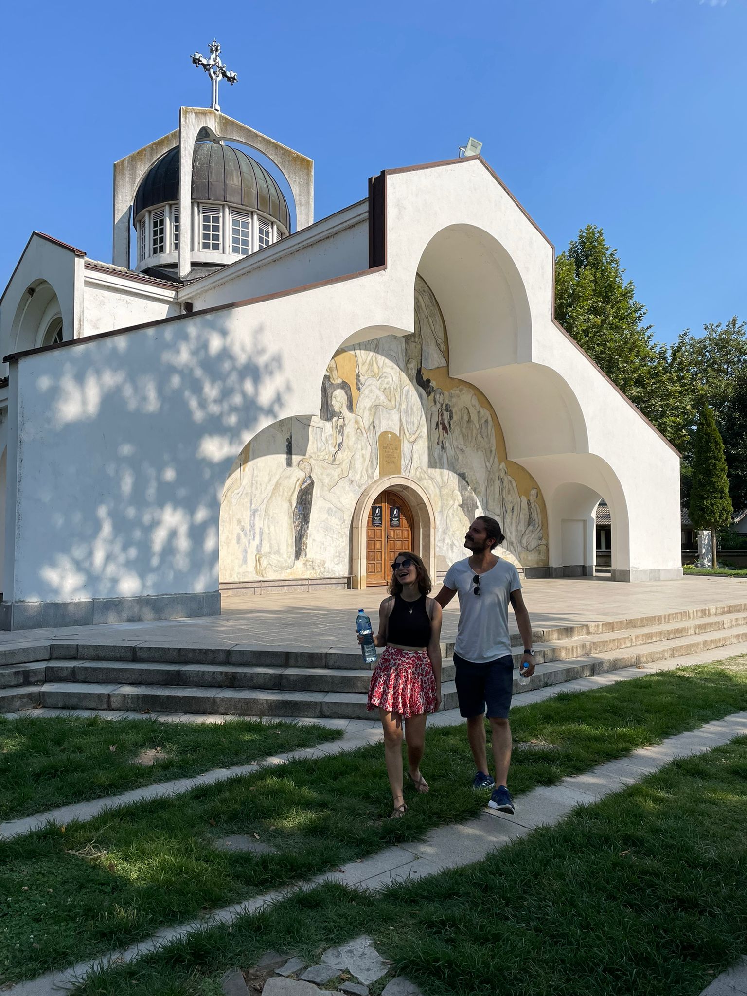 Özgür and Gülfiye outside the church at Baba Vanga's memorial complex
